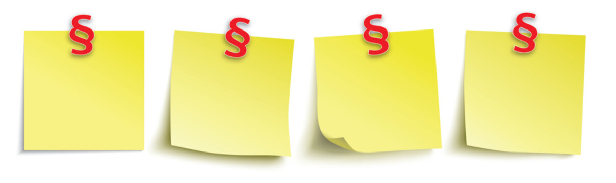 Gelbe Klebezettel mit den roten Paragrafen als Pins drauf.