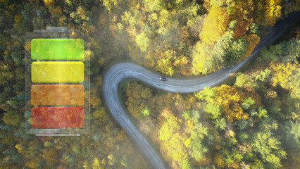 Aerial view of a black electric car on a winding road with a 3D graphic overlay of a battery, symbolizing EV power