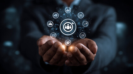 Businessman holding network of connected icons representing business development and teamwork