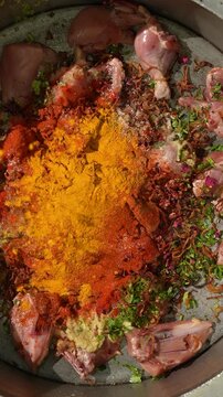 Hyderabadi Chicken Dum Biryani being Marinated  - Spice adding