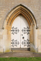 Wooden door and ornate archway of a beautiful old church