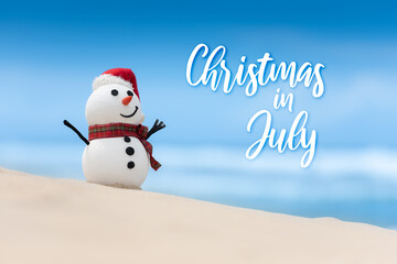 Christmas in July sale template design with a snowman on a beautiful beach