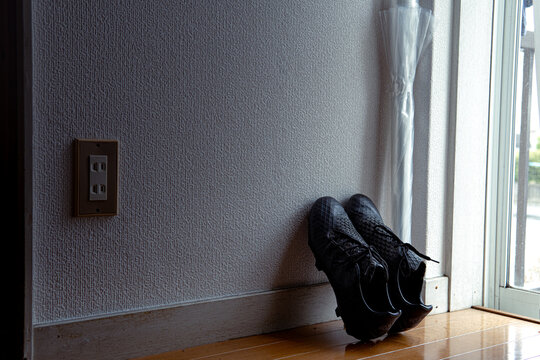 ootball Boots Resting on Turf Beside Goal Post, Sports Gear and Outdoor Activity Theme"

