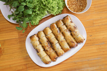 Thai Deep-Fried Spring Rolls with Dipping Sauce and Fresh Vegetables
