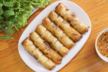 Thai Deep-Fried Spring Rolls with Dipping Sauce and Fresh Vegetables