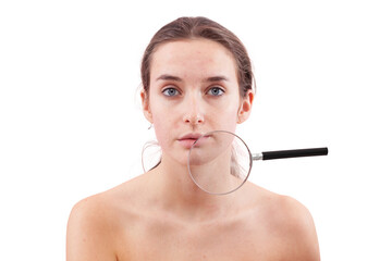 Fototapeta premium Portrait of woman with no makeup, real skin with acne and blemishes under magnifying glass, Authentic female face with imperfections before skincare or beauty treatment, isolated on background