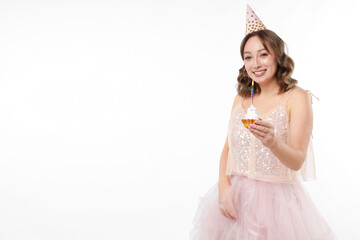 Birthday celebration. Woman with cupcake on white background. Space for text