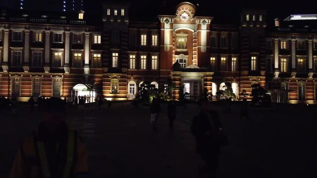 fast forward night time view of Tokyo main station an ancient famous tourist attraction landmark of Tokyo in people hangout aroung tokyo station squre