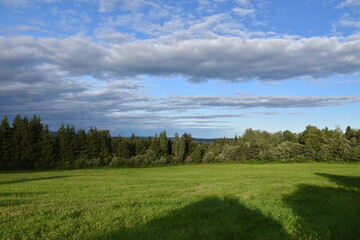 Obraz premium A field at the end of the day in summer, Sainte-Apolline, Québec, Canada