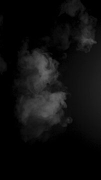 Slow motion smoke drifting on black background for cinematic effects. High quality 4k footage