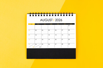 August desk calendar for 2026 year on yellow background for schedule to make appointment.