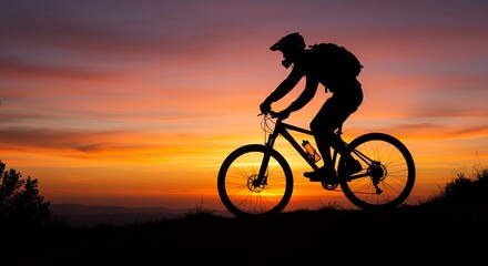 Mountain biker riding against a sunset