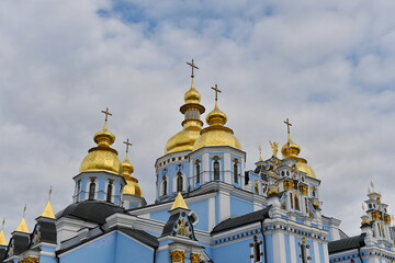 Domes of a church against a blue cloudy sky