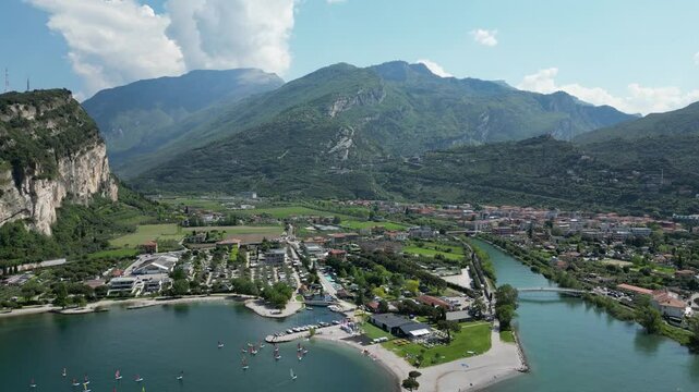 Aerial view of Riva del Garda and Torbole with river Sarco. View of sailboats, surfers and camping places on northern part of Lake Garda.