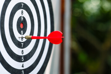 A dart stuck on the target but not precise enough to hit the center, business, and communication...