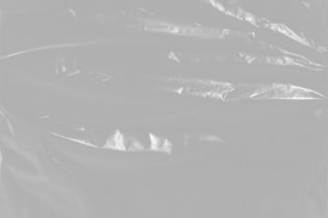 plastic overlay texture of realistic crumpled transparent plastic film wrap on black background,wrinkled stretched plastic effect.	