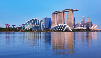 SINGAPORE, SINGAPORE - OCTOBER 2019: Skyline of Singapore Marina Bay at night with Marina Bay sands, Art Science museum and tourist boats