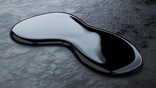 A black liquid is shown taking on various shapes on a smooth surface with a droplet falling and creating ripples