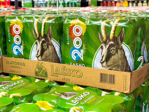 La&scaron;ko beer packaging featuring zlatorog icon in a store display