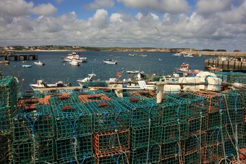 View across lobster pots to the fishing port of Sagres in Portugal