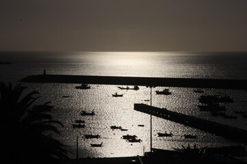 View of the fishing harbour of Sagres in southern Portugal by sunrise