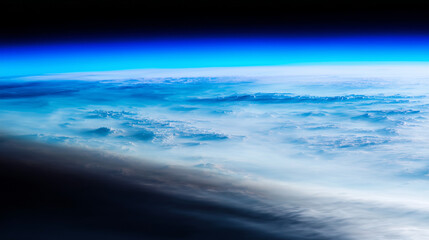 Aerial view of Earth's atmosphere with glowing blue ozone layer and dark gap symbolizing depletion, environmental protection and climate change awareness concept.