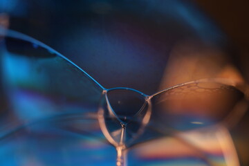 blue liquid surface on black background, oil stains movement, bright chemistry, surreal background,...