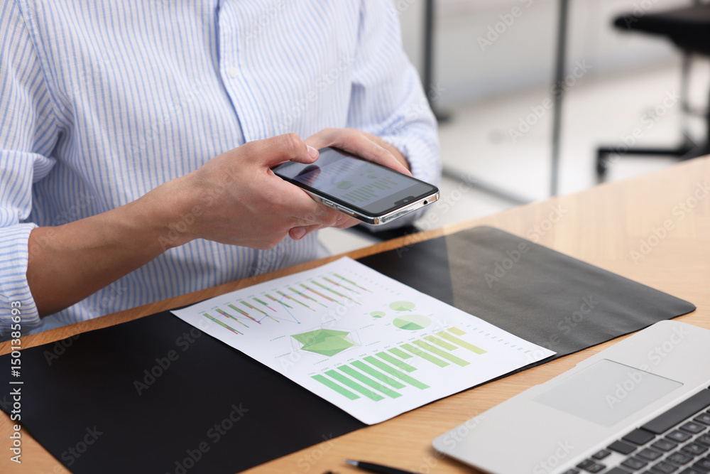 Poster man taking photo of document using scanning app on smartphone at desk in office, closeup