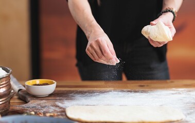 In a warm kitchen, a child’s hands knead dough, embodying the joy of learning to bake. Flour...