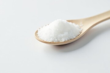 Spoonful of white sugar against white backdrop, white background, shiny