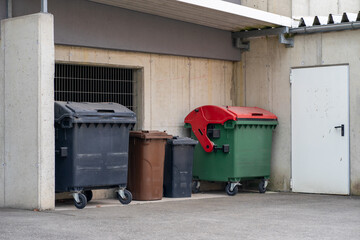 View of large and small plastic containers for various types of garbage