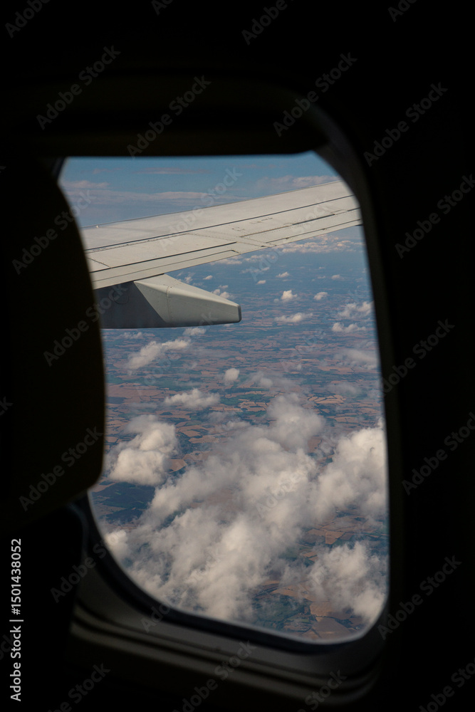 Poster a view of the clouds from an airplane window