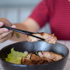 a hand pick grilled chicken slice