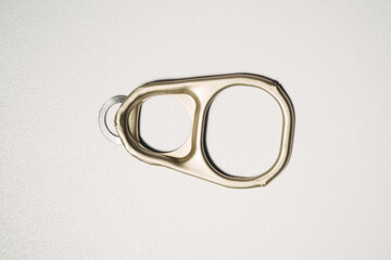 A can opener is shown on a white background