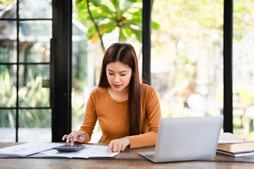 Business financing accounting banking concept. Businesswoman hand doing finances and calculate on...