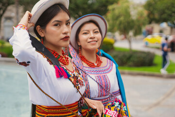 Indigenous riobamba women showing traditional clothes and hats in ecuador