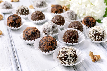Assorted raw vegan balls Truffles on White Table