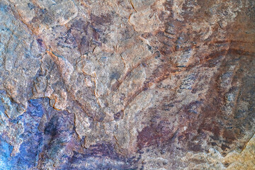 Organic rock texture with earthy pigments.