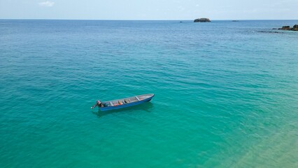 Aerial View of a Boat in Stunning Crystal Clear Waters of Principe Island, Africa
