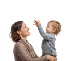 A mother and baby share a sweet moment as the child reaches towards something unseen.