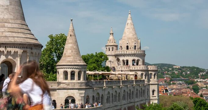 Budapest, Hungary - May 3, 2025: Fisherman's Bastion towers seen from the observation deck perspective. Timelapse, slide transition.