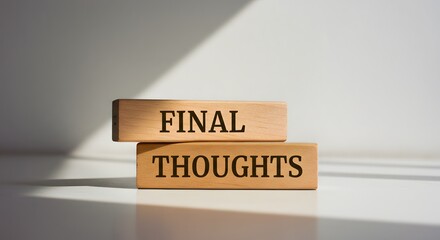 Message 'Final Thoughts' displayed on wooden cubes, perfect for summaries or closing remarks

