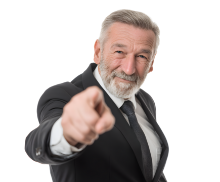 A distinguished gentleman in a formal suit points directly toward the viewer with a smile.