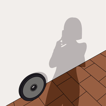 Woman's Shadow and Barbell Weight Plate by a White Wall