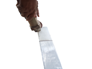 Close-up of Hands Using an Angle Grinder to Smooth a Metal Surface