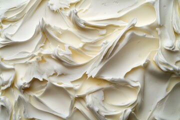 Close-up of textured white cream, frosting, or butter surface filling the frame. Perfect for baking, cooking, dessert, or culinary related designs and backgrounds.