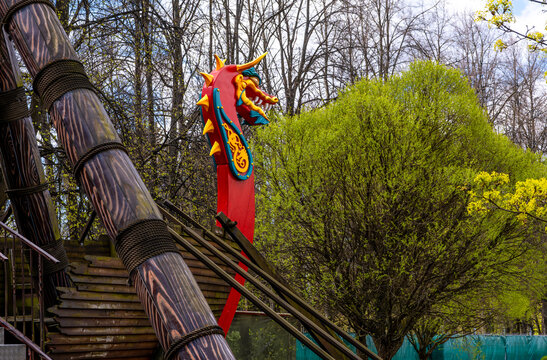 The nose of a Viking rook in the shape of a dragon on the playground in the park.Viking dragon drakar.