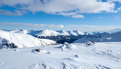 Snow Covered Mountain Range Under a Bright Blue Sky