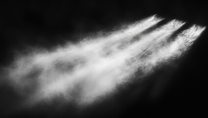 Light beams cutting through a smoky, dark space