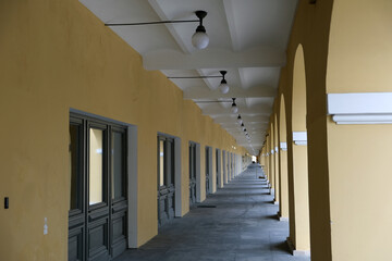 street gallery with arches and lamps on the ceiling
